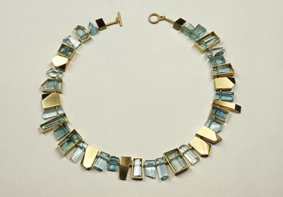 Suzan Rezac, jewelry. Necklace: 18K green gold, aquamarines
